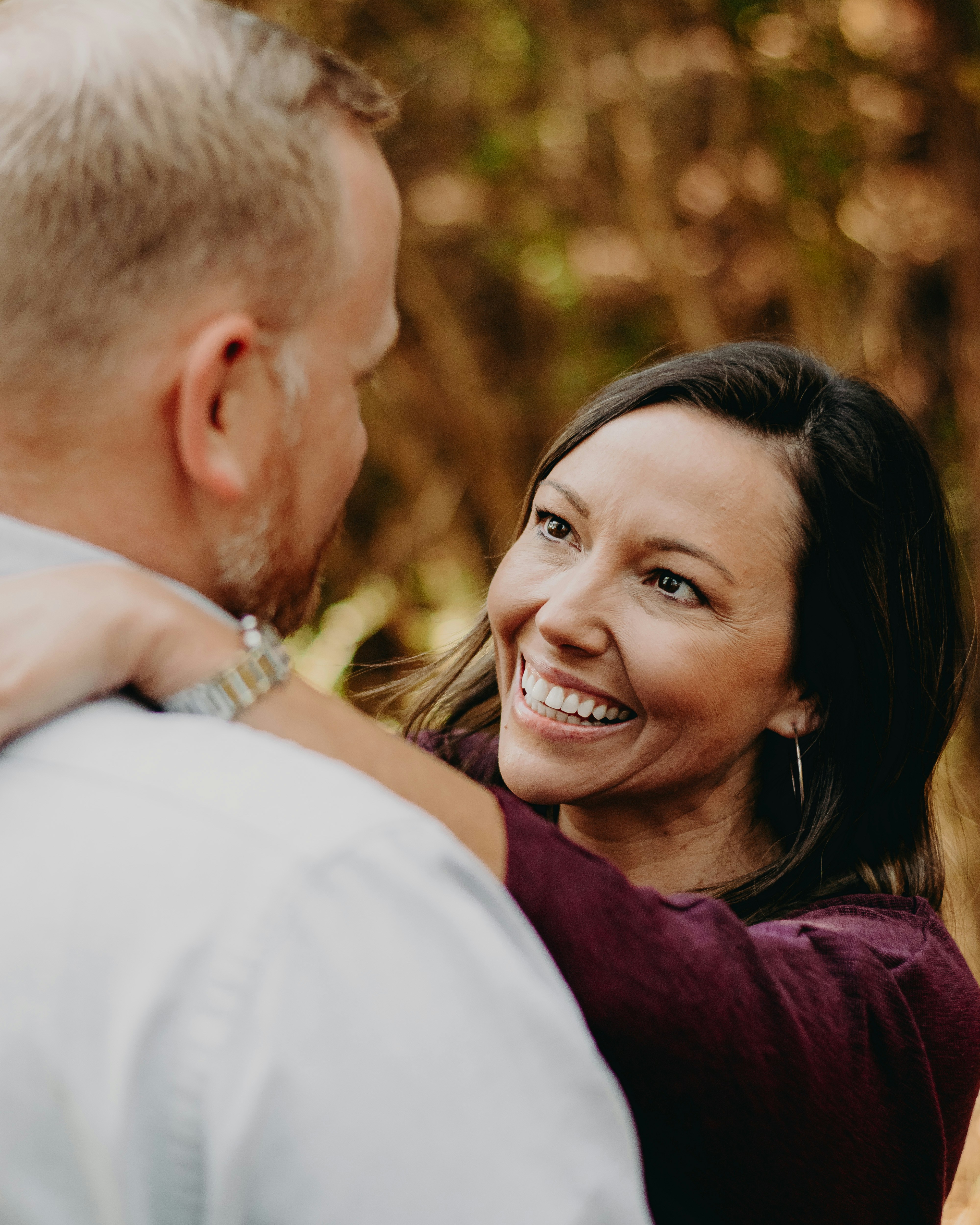 Beautiful woman with arms on husbands shoulders - Instagram @baileyburtonphoto - Donate to me on Cashapp! $17thcw Thank you for your support!