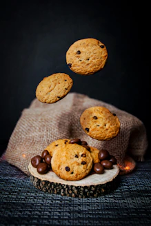 chocolate chip cookies falling off of a bag