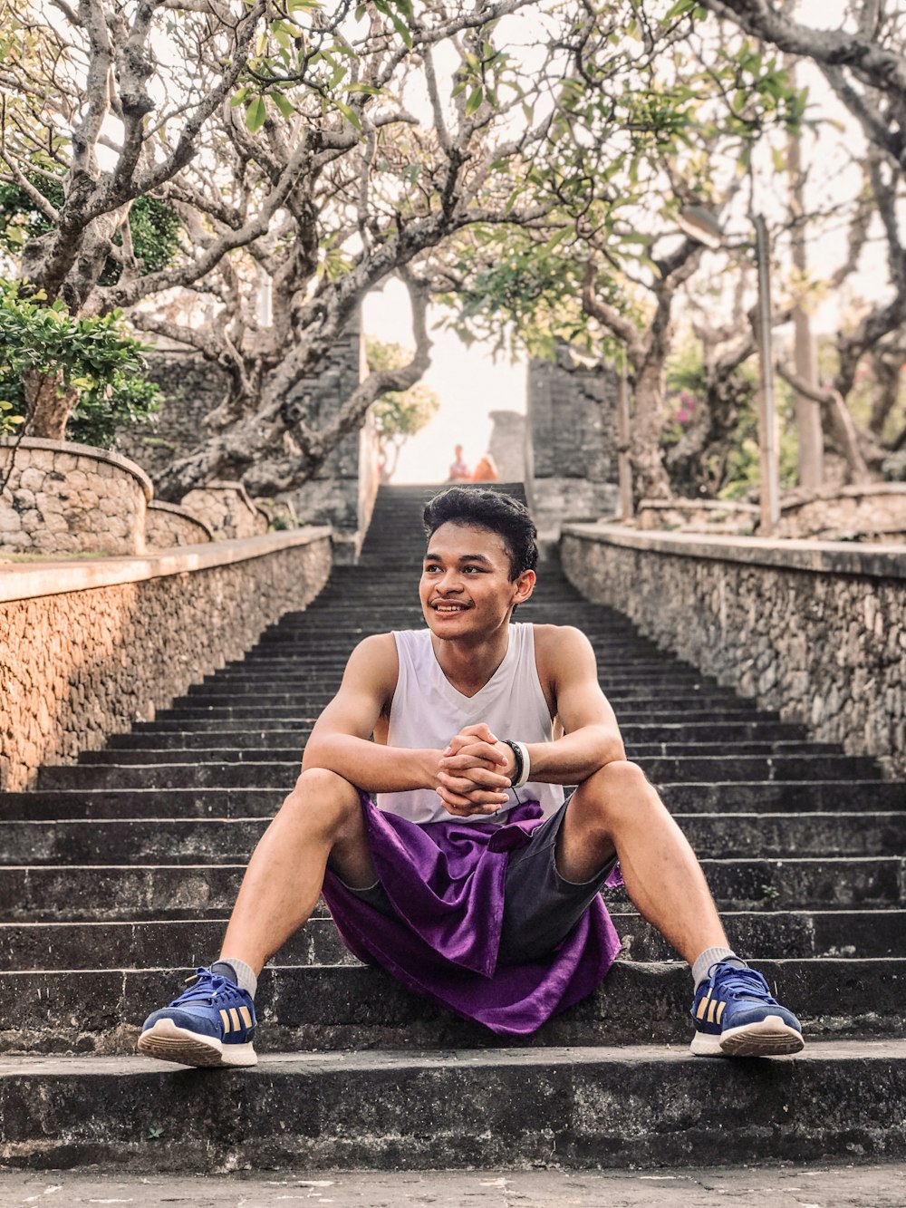 a man sitting on a set of stairs