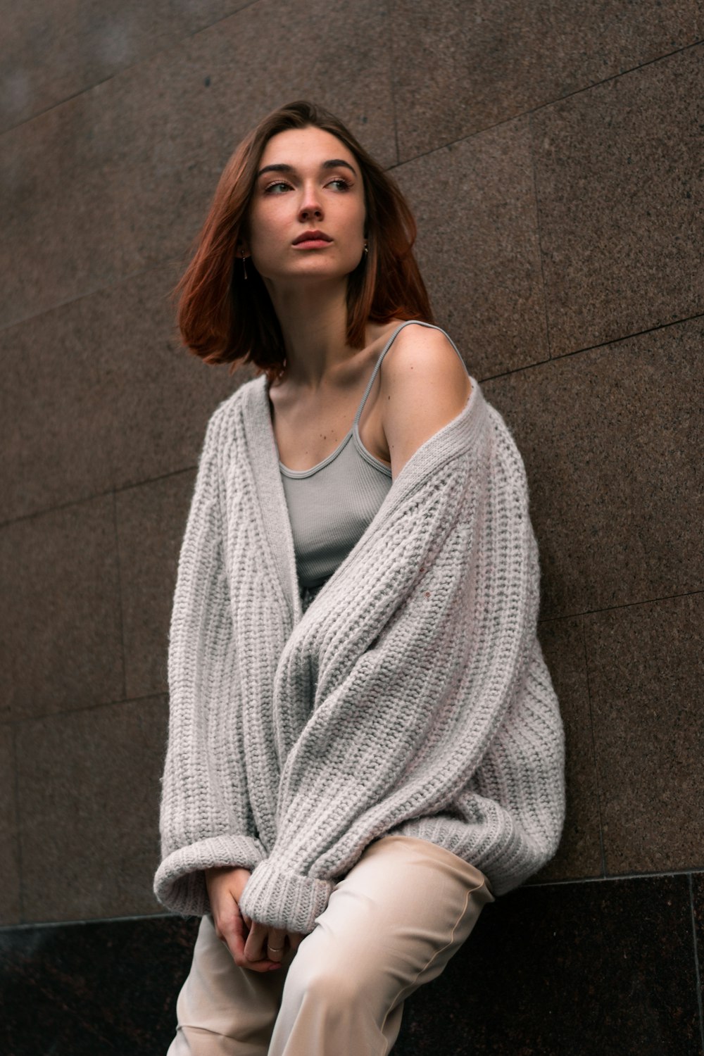 a woman standing in front of a building