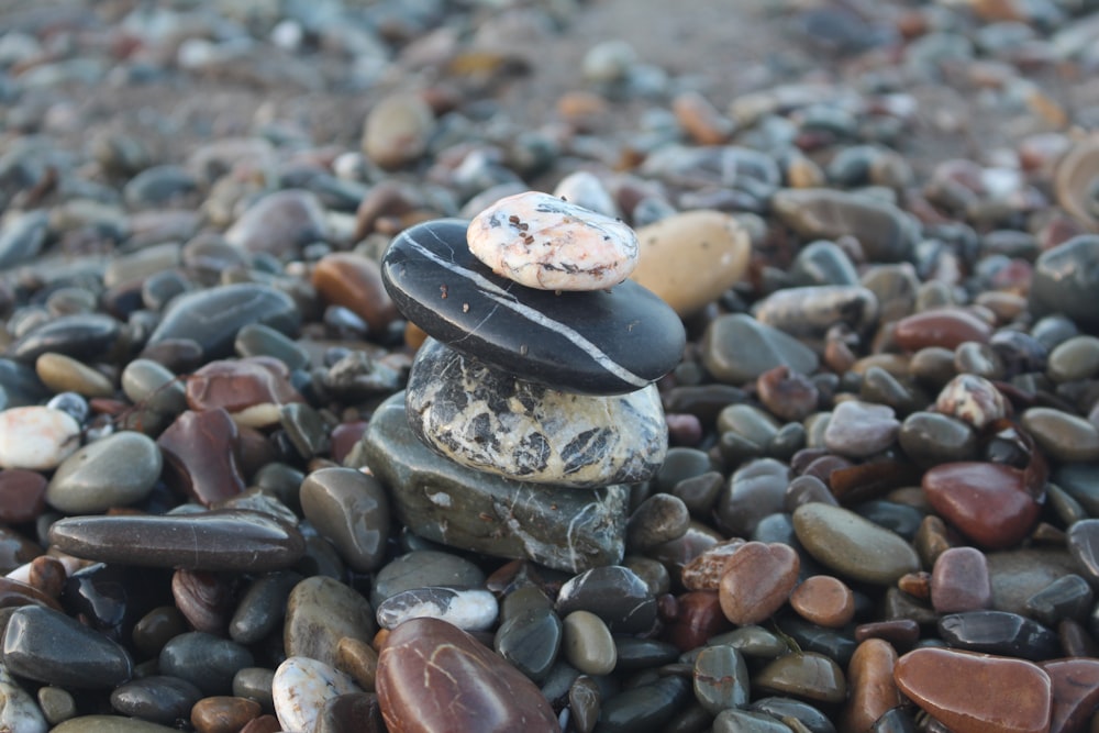 a stack of rocks with a doughnut on top of it