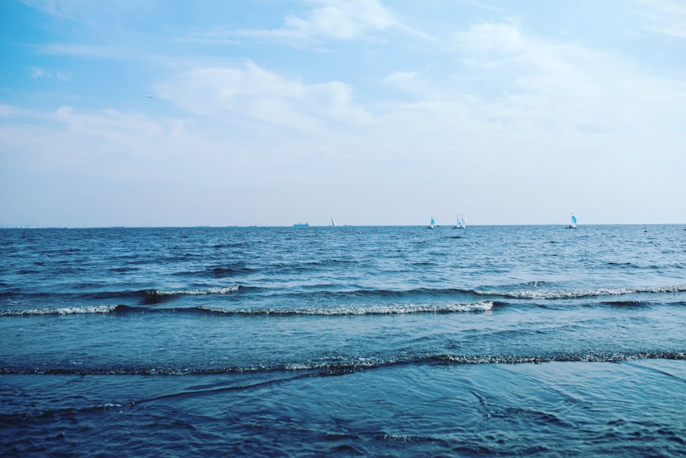 a body of water with boats in the distance