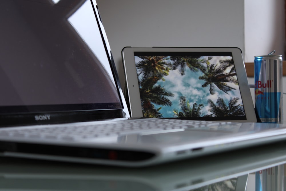 a laptop computer sitting on top of a desk