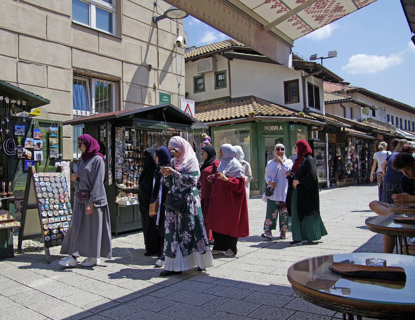 Muslim ladies walking along streets of Sarajevo, Bosnia and Herzegovina