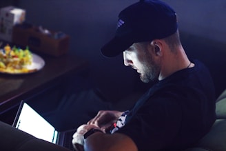 a man sitting in front of a computer