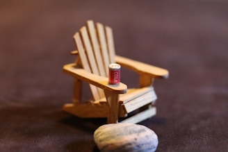 Close-up of miniature Scandinavian furniture on a wooden surface