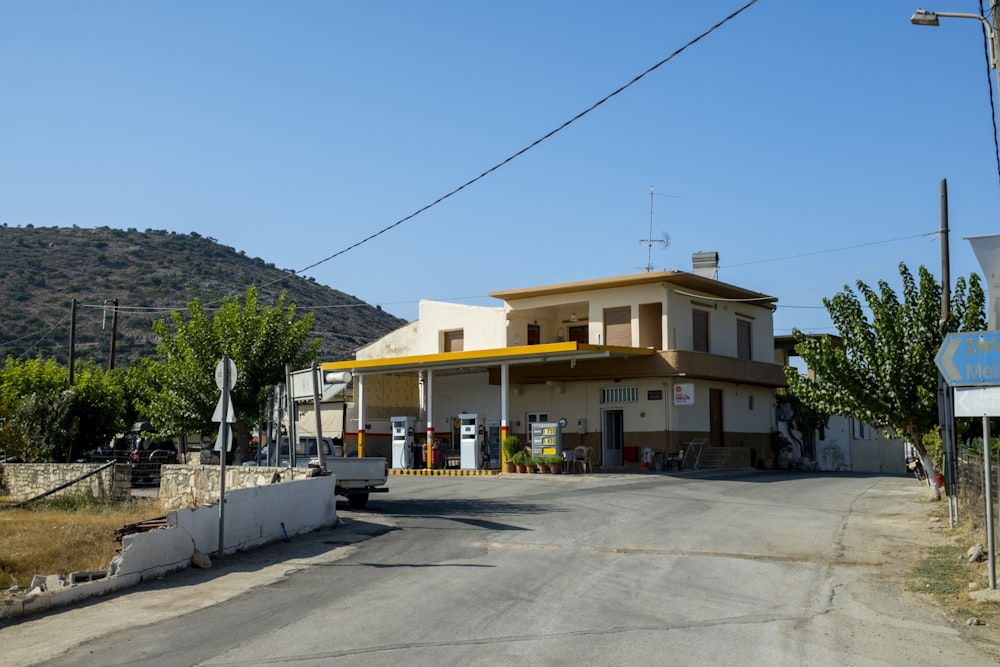 a gas station on the side of a road