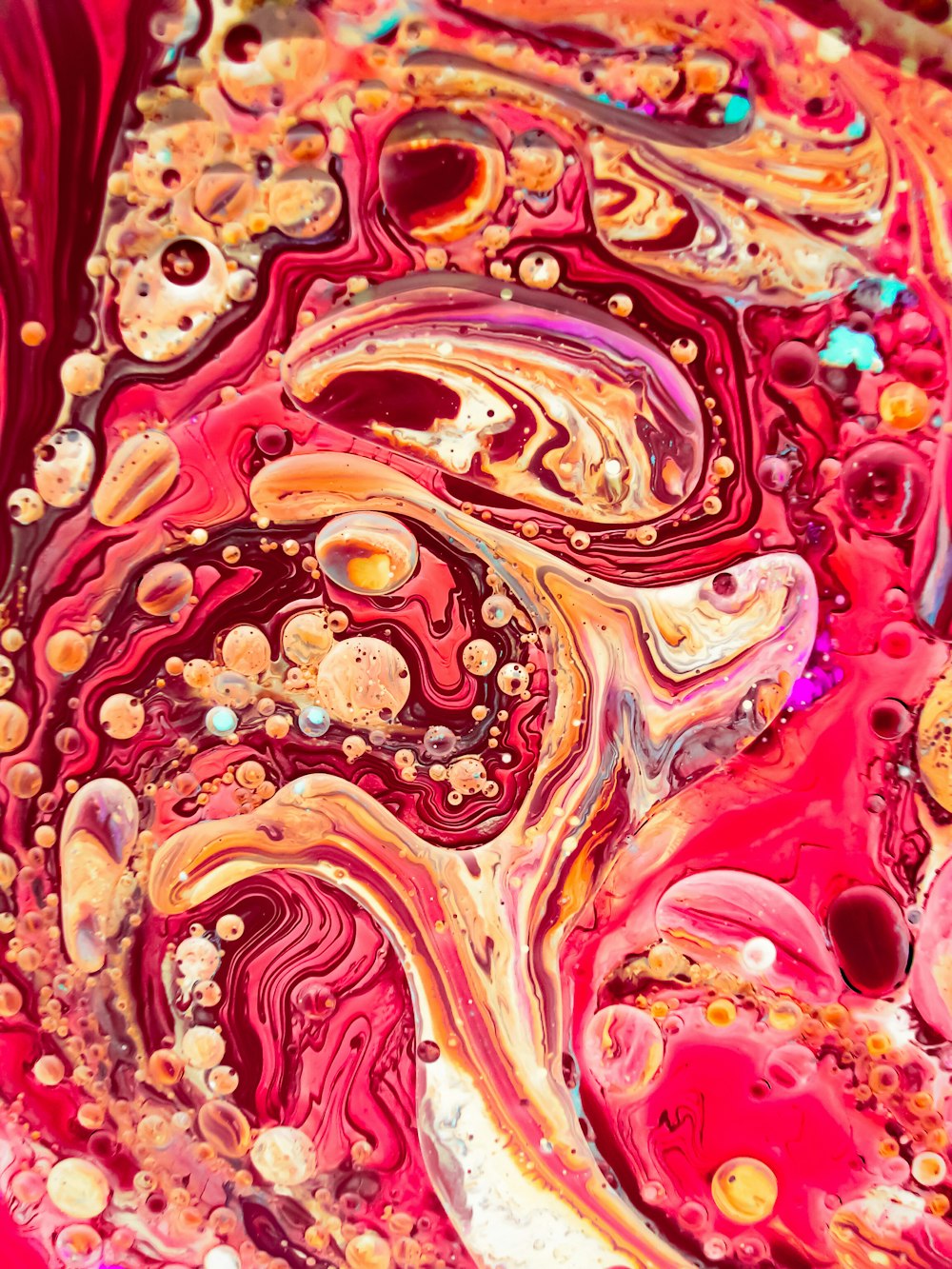 a close up of a red and yellow fluid substance