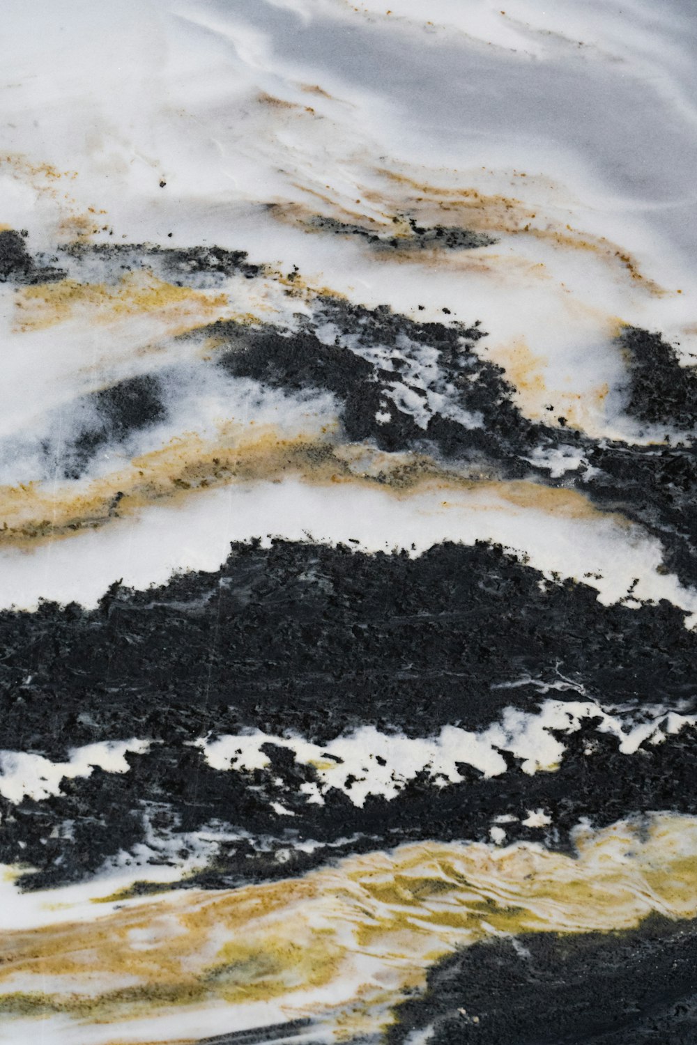 a close up of a black and white cake