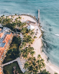 an aerial view of a resort and beach