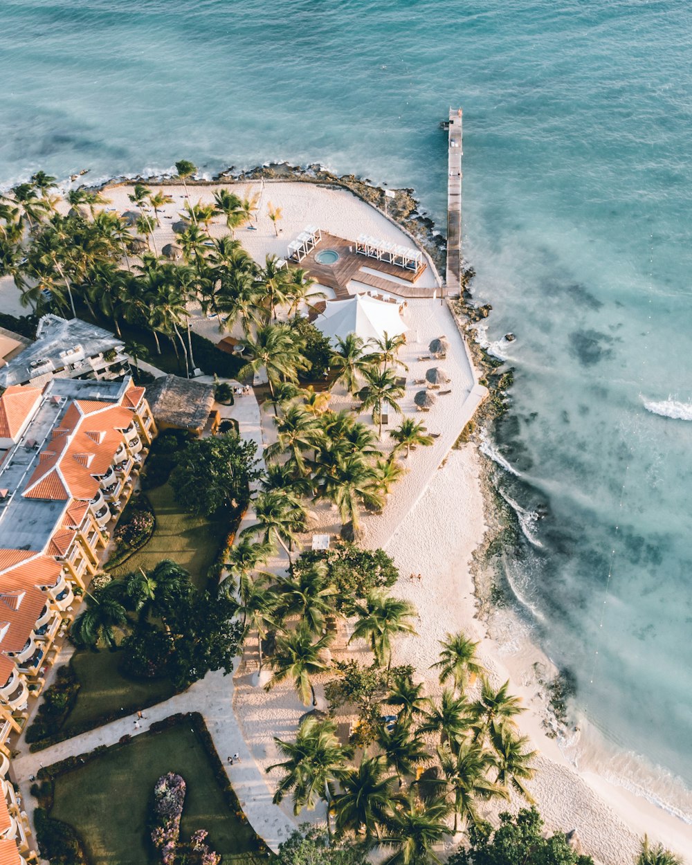 an aerial view of a resort and beach