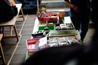 Healthy snacks in biodegradable containers on a rustic table.