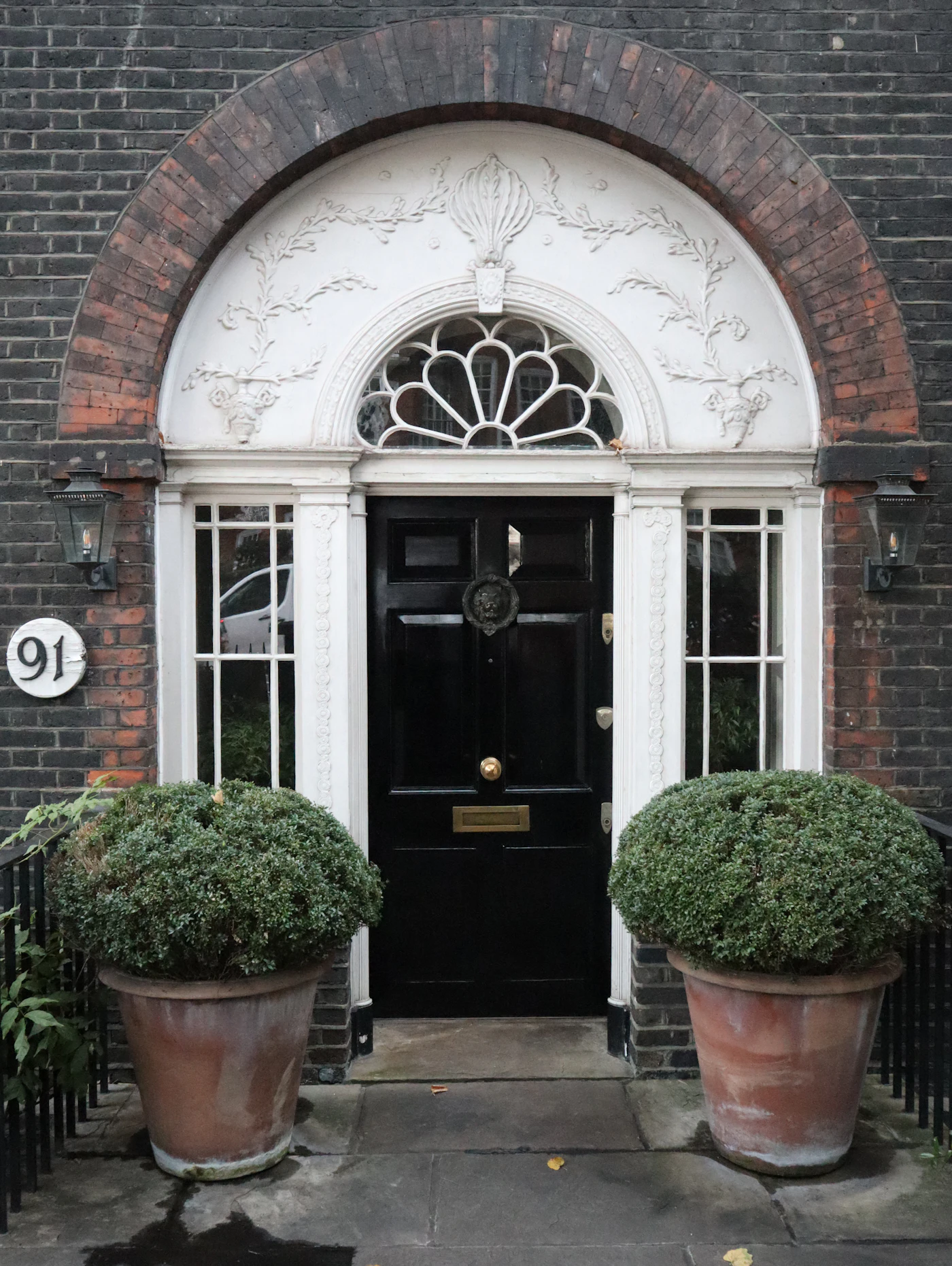 A black Georgian front door on Cheyne Walk, Chelsea
