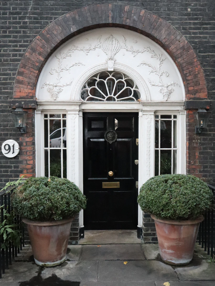 A black Georgian front door on Cheyne Walk, Chelsea