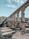 an old stone bridge with arches and arches