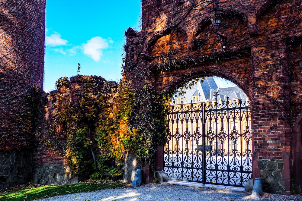 a gate that is next to a brick building