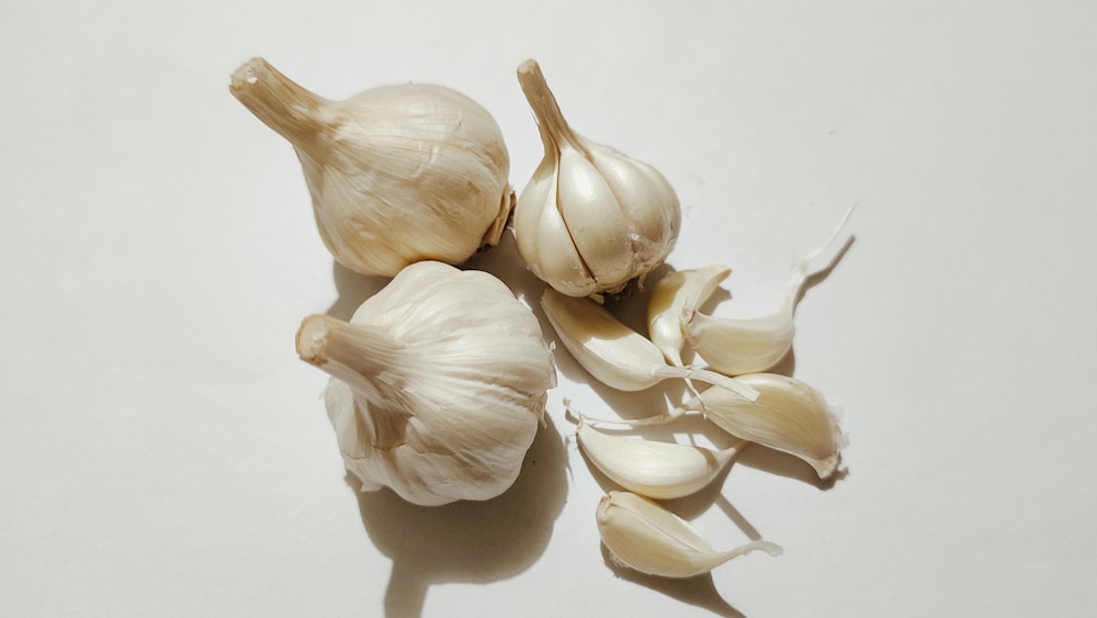 a couple of garlics sitting on top of a table