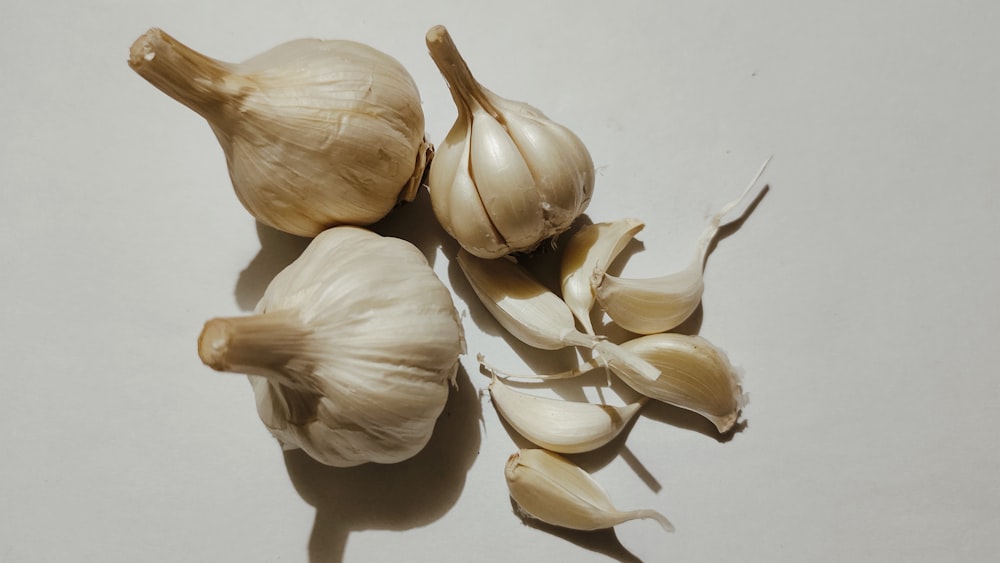 a couple of garlics sitting on top of a table