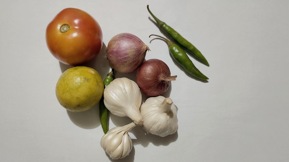 a group of vegetables sitting on top of a table