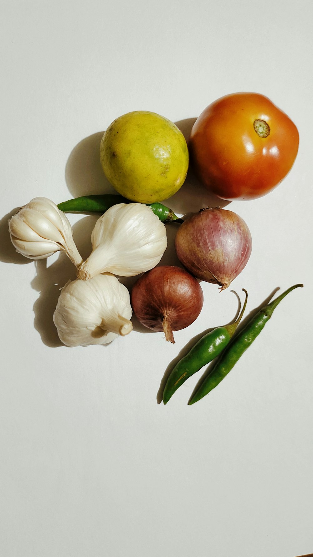 a group of vegetables sitting on top of a table