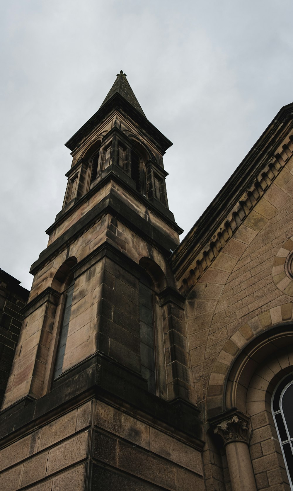 a tall tower with a clock on the top of it