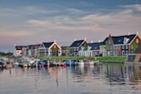a row of houses next to a body of water