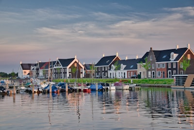 a row of houses next to a body of water