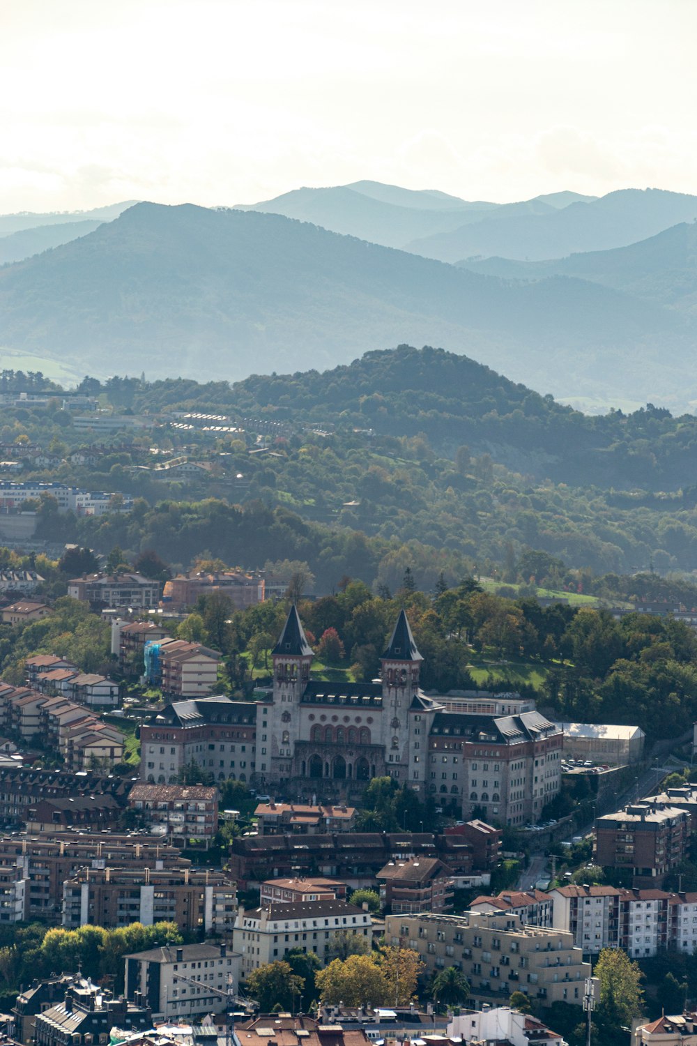 a view of a city with mountains in the background