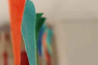 Wool felt pads arranged artistically with vibrant background colors