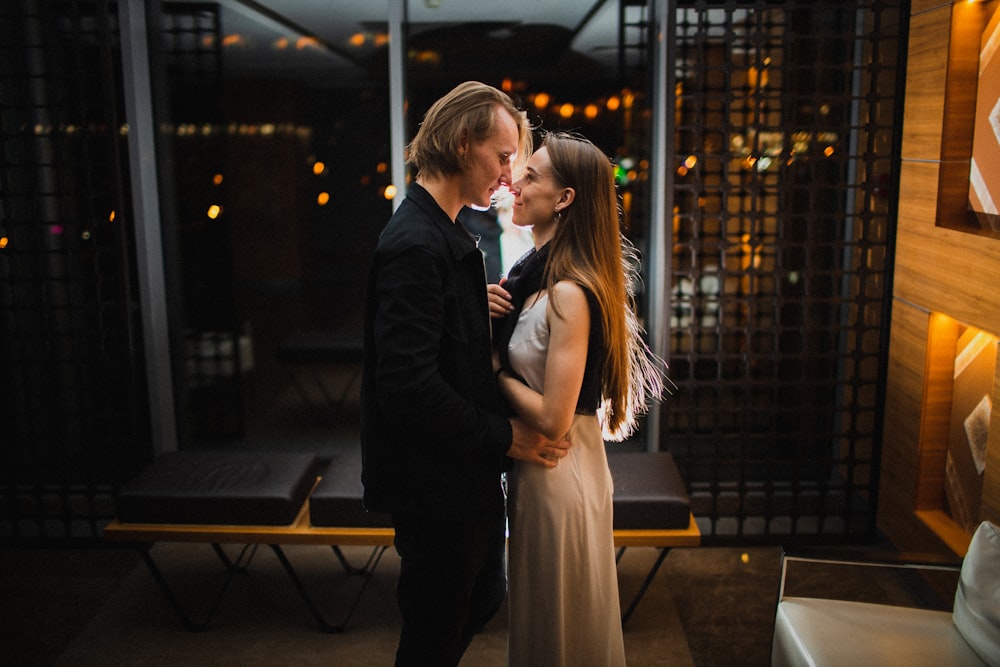 a man and a woman standing next to each other