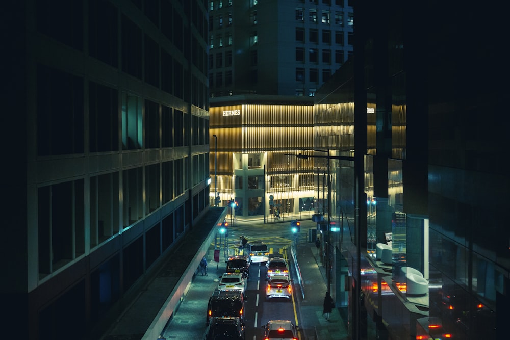 a city street filled with traffic at night