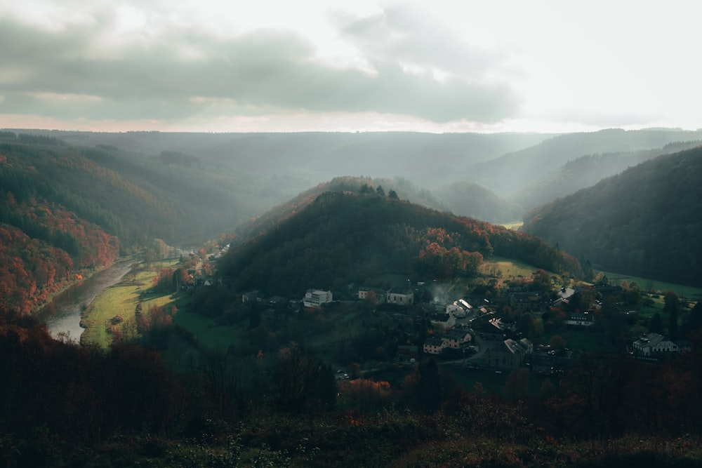 a scenic view of a valley with a river running through it