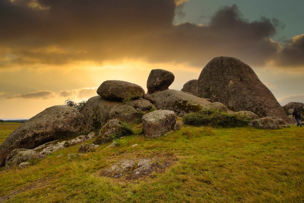 a man standing on top of a lush green field