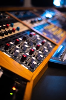 a close up of a sound mixing console
