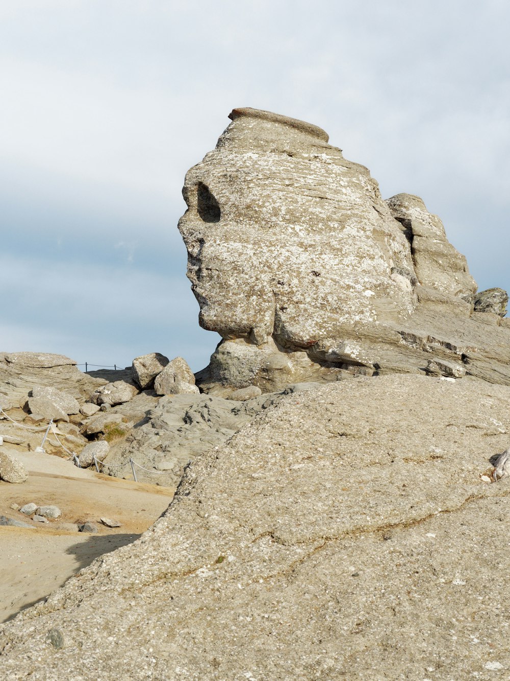 a large rock formation in the middle of a desert