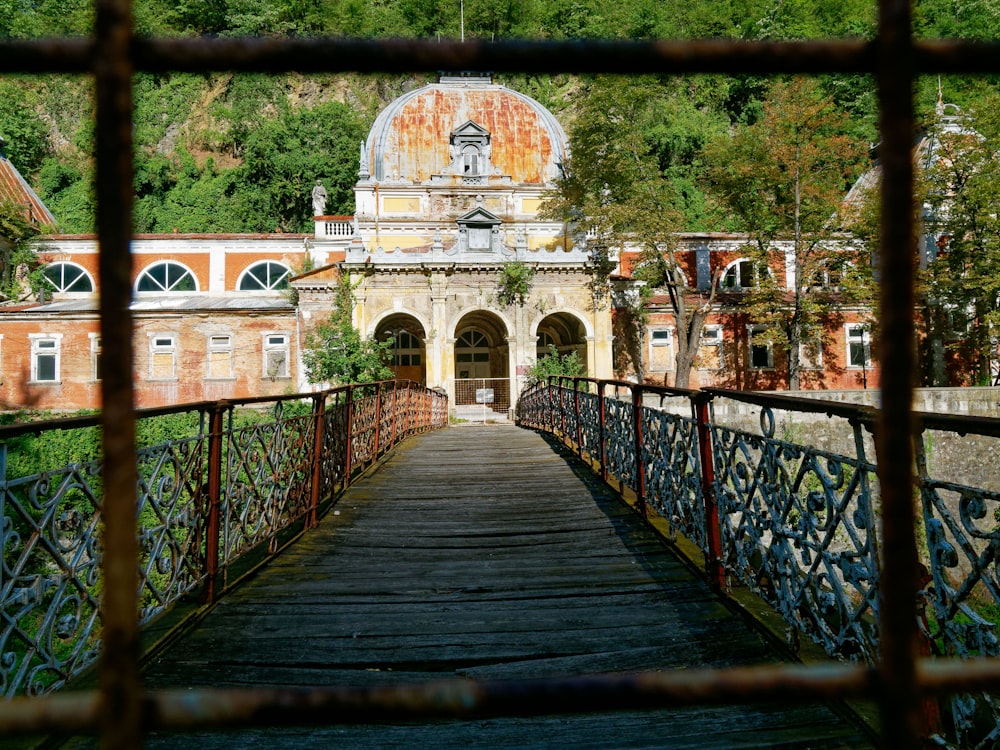 a view of a building through a fence