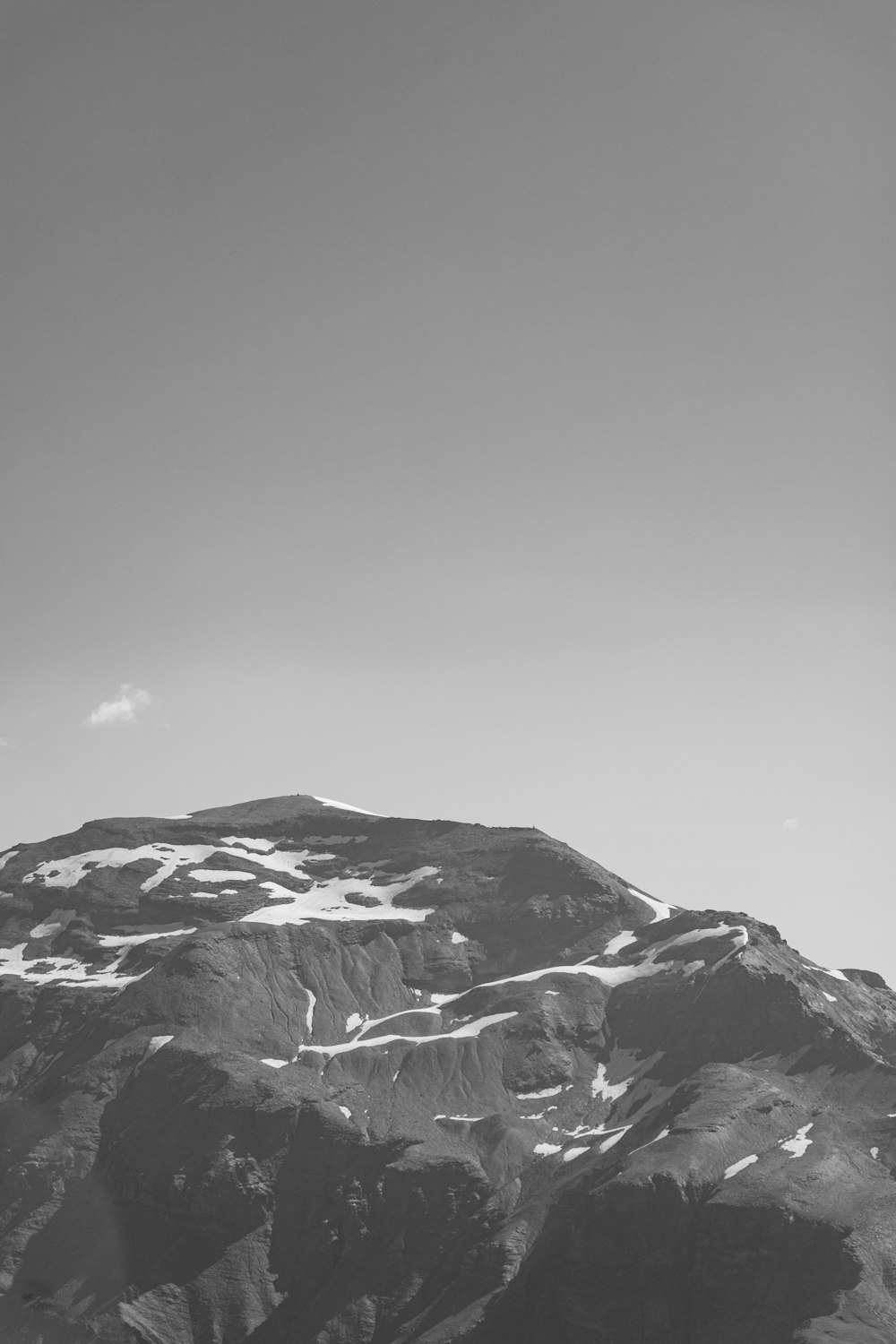 a black and white photo of a mountain