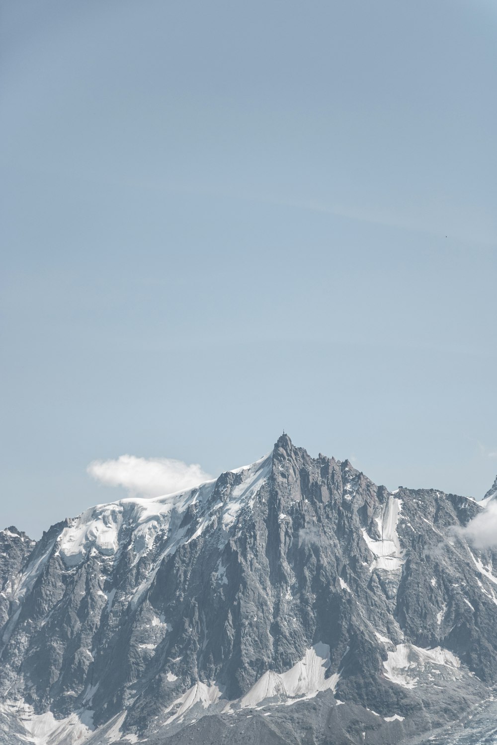 a snow covered mountain with a sky background