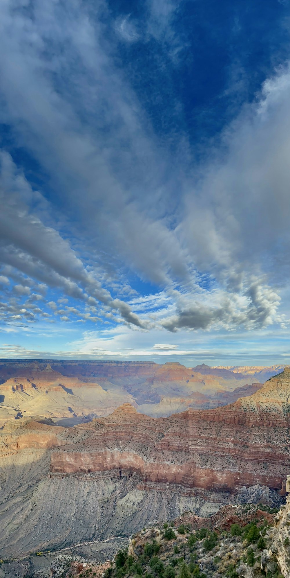 a view of the grand canyon from the top of a hill