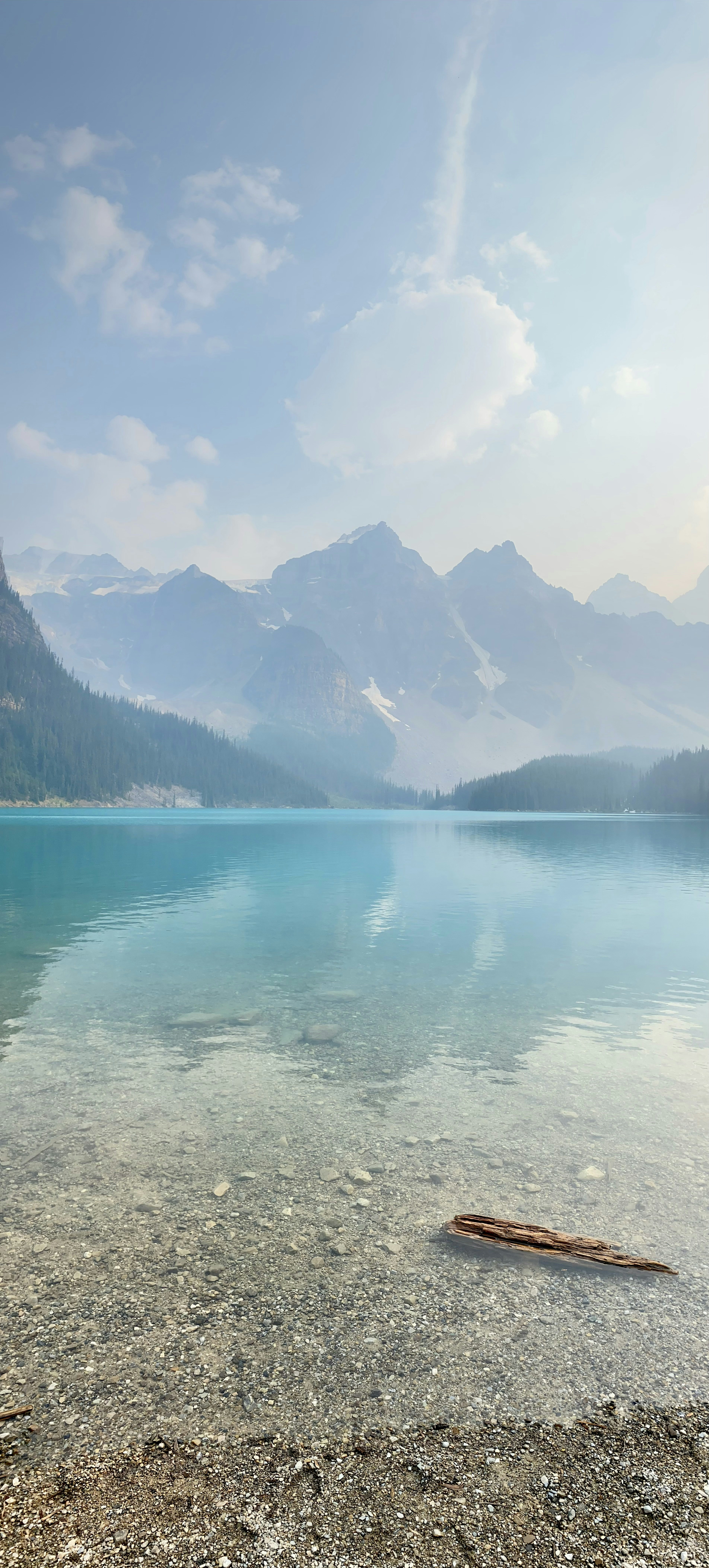 a body of water with mountains in the background