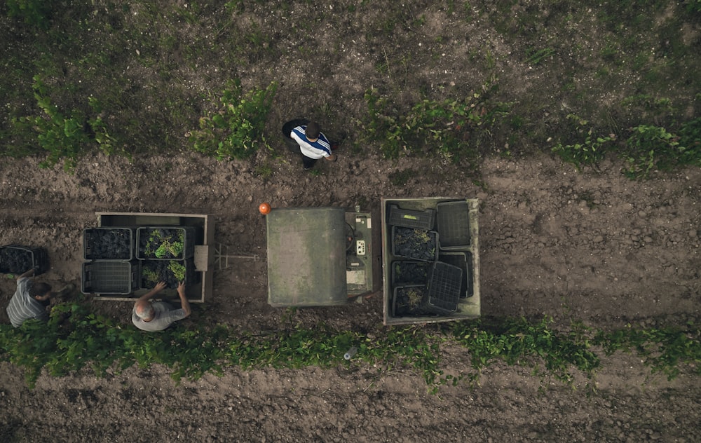 a couple of people sitting on top of a field