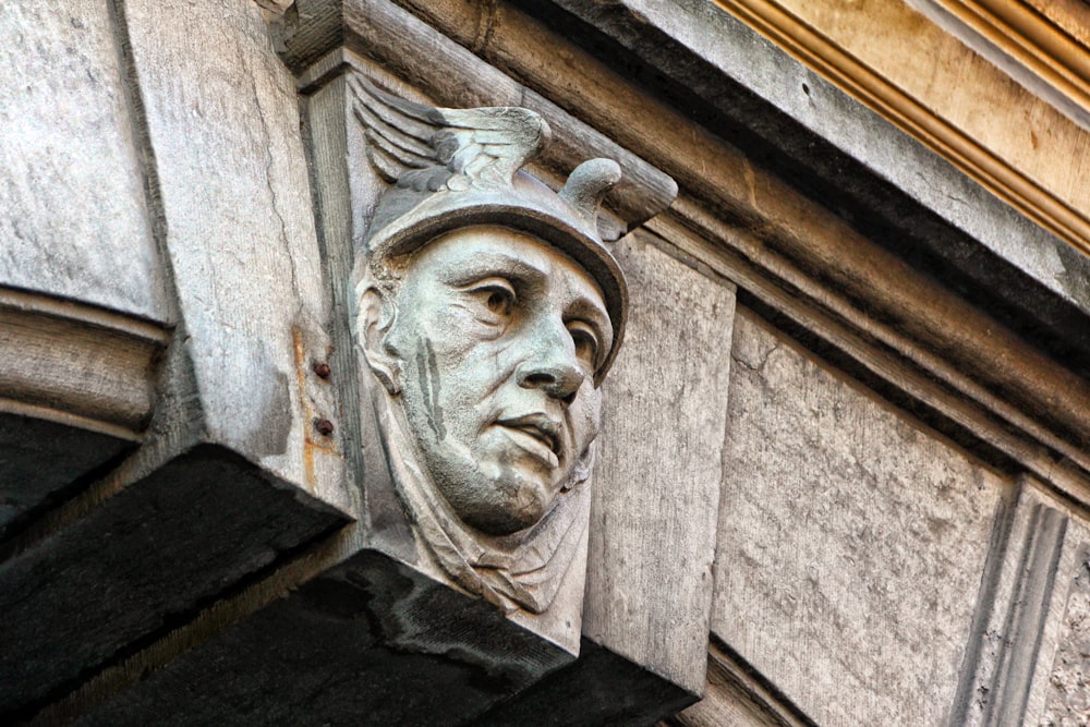 a close up of a face on a building