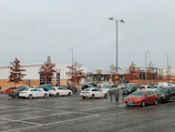 a parking lot filled with lots of parked cars