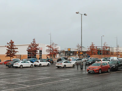 a parking lot filled with lots of parked cars