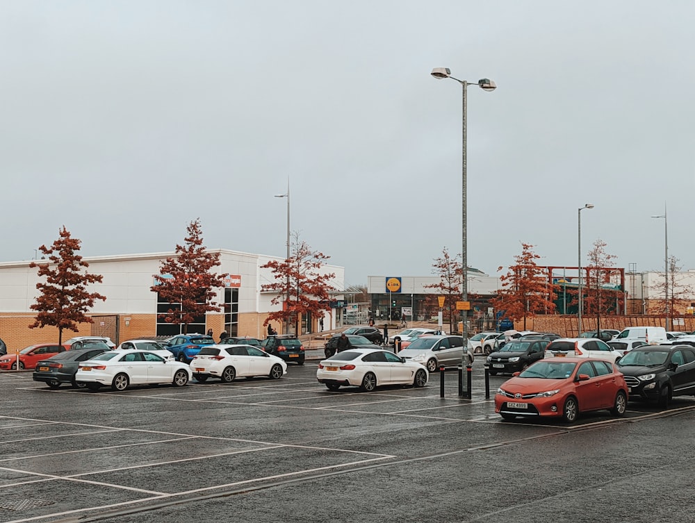 a parking lot filled with lots of parked cars