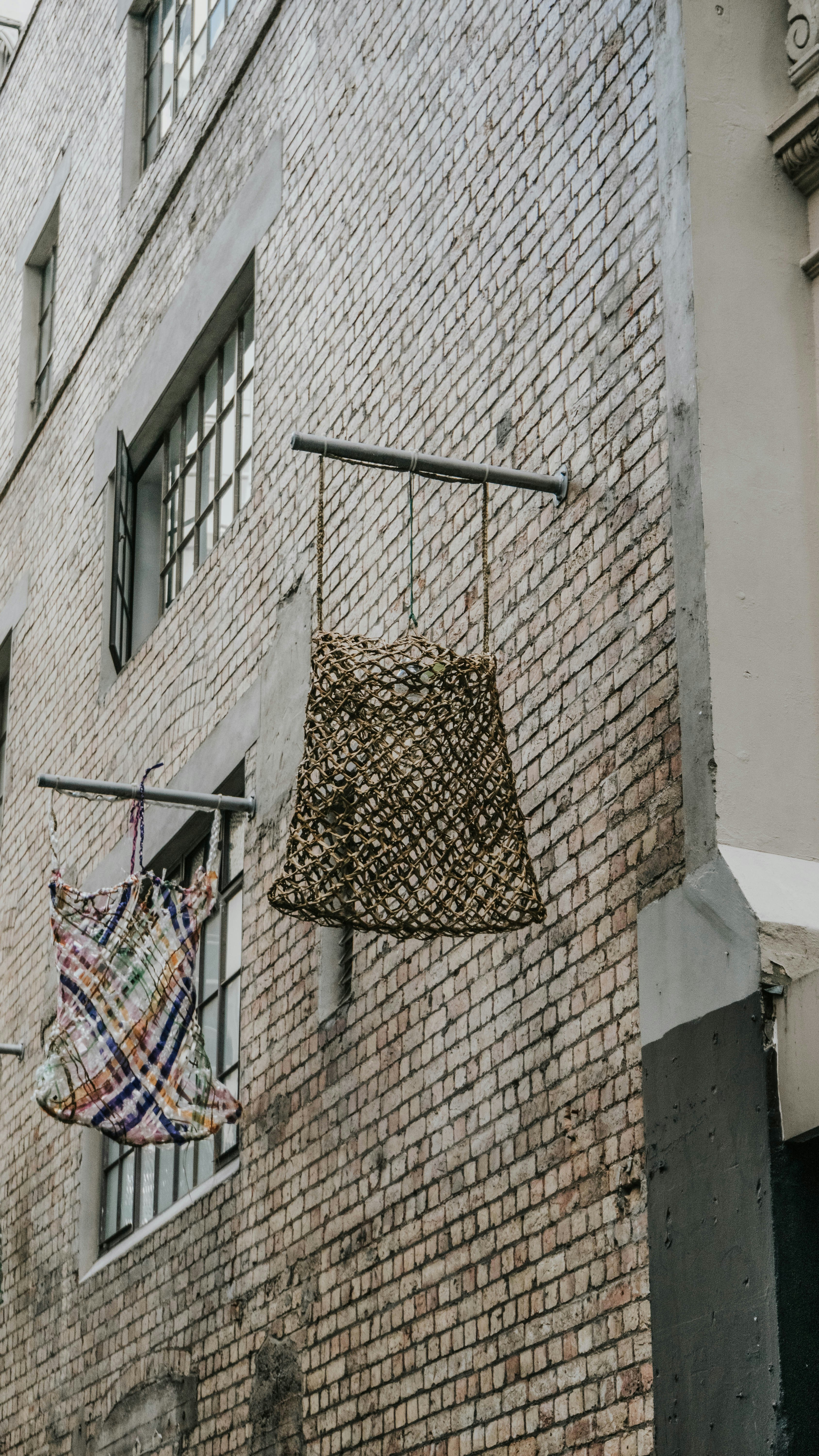 a brick building with a tarp hanging from it's side