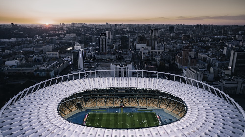 an aerial view of a soccer stadium in a city