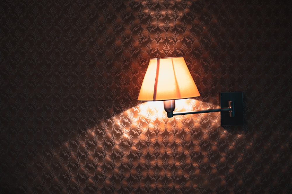 a lamp that is on a wall in a room