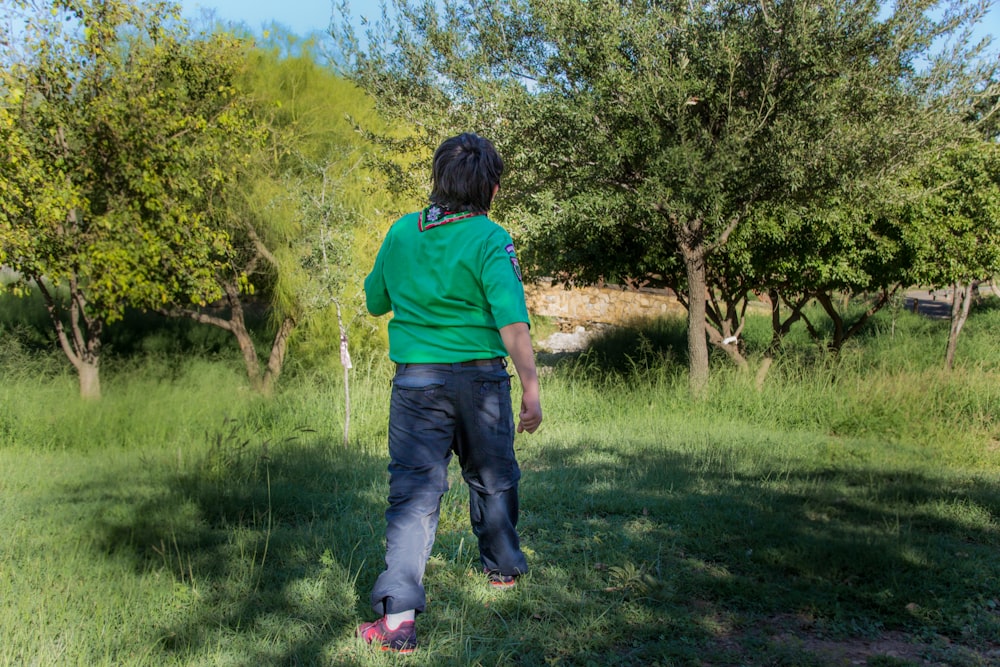 a person in a field with a frisbee