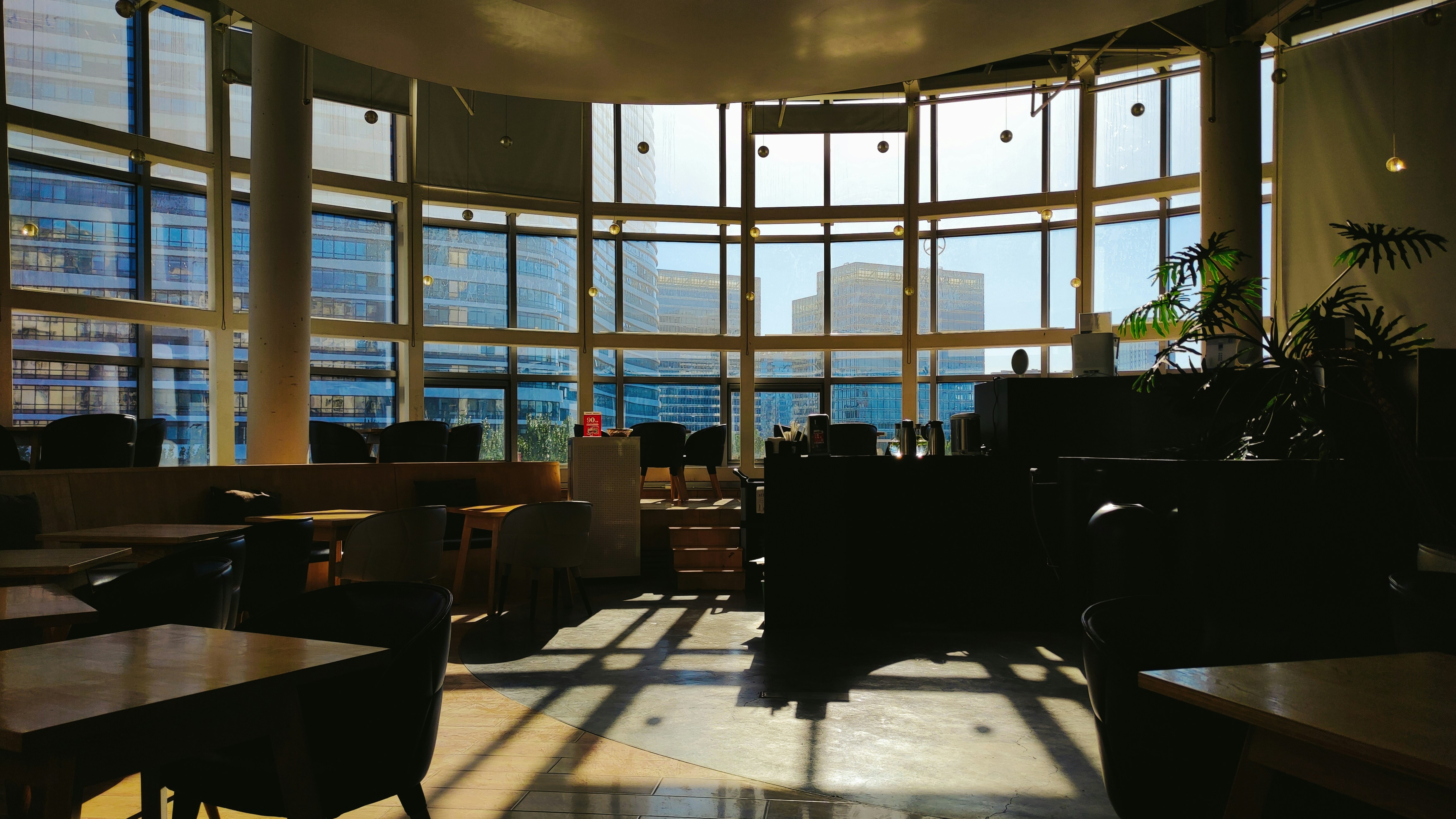 a large room with lots of windows and furniture